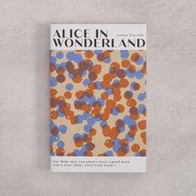 Bookishly edition of Alice in Wonderland by Lewis Carroll with a blue and rust dot-patterned dust jacket and personalised message printed on the front cover.