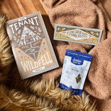 Bookishly edition of The Tenant of Wildfell Hall by Anne Brontë with a warm-toned dust jacket, Bron-tea tea, and a matching quote bookmark – part of the rolling classic book subscription.