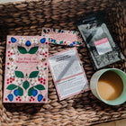 Bookishly edition of Far From the Madding Crowd with floral dust jacket, Perkulatte coffee, discussion card, quote bookmark, and a mug of tea – part of the monthly classic book subscription.
