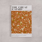 Bookishly edition of The Great Gatsby by F. Scott Fitzgerald with an orange daisy-patterned dust jacket and personalised message printed on the front cover.