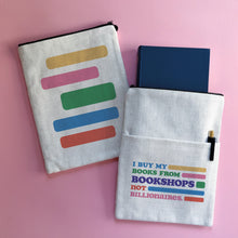 Bookshops Not Billionaires book sleeve made from linen-effect fabric on a pink background