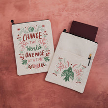 Linen-effect book sleeve with Scandinavian folk art quote Change the World One Page at a Time