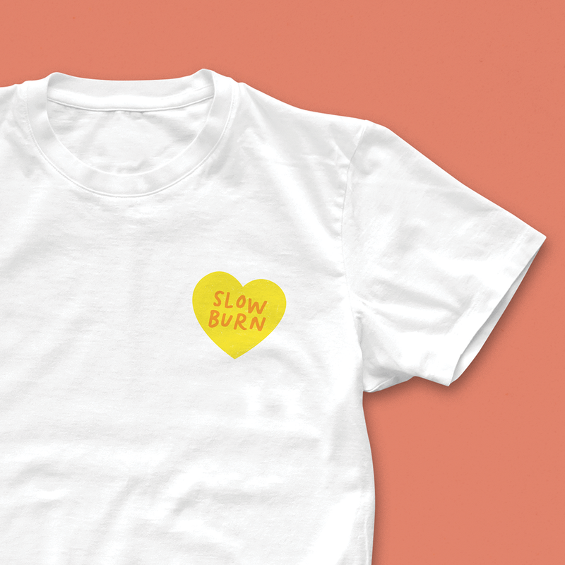 Slow Burn T-shirt with small yellow heart and hand-lettered red text, perfect for fans of slow burn romance and bookish gifts
