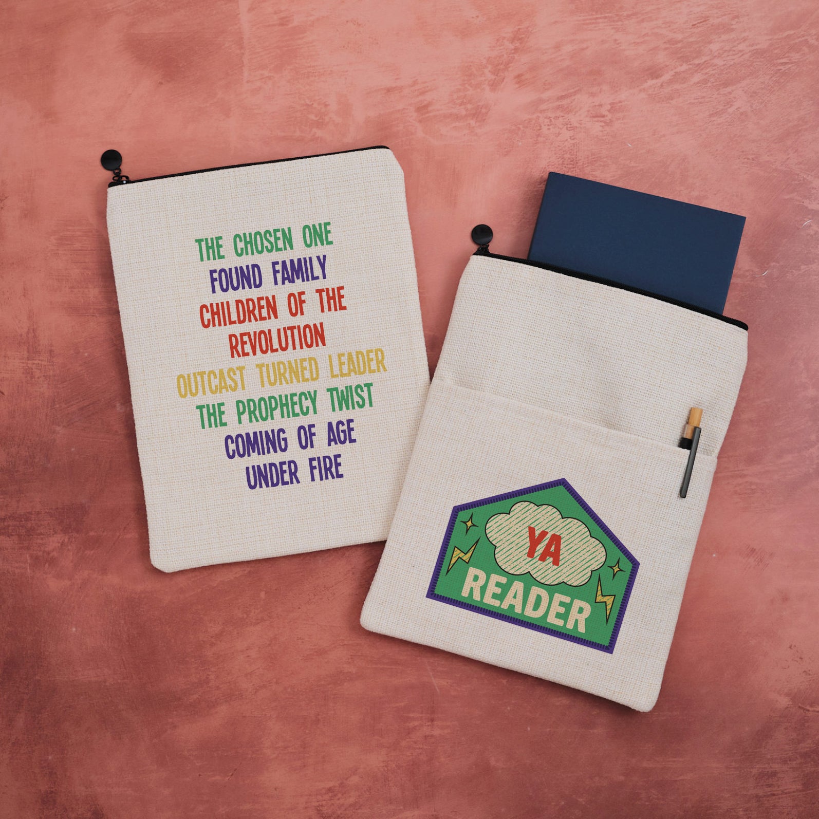 Double-sided YA Reader book sleeve with merit patch design on one side and rainbow YA tropes list on the other.