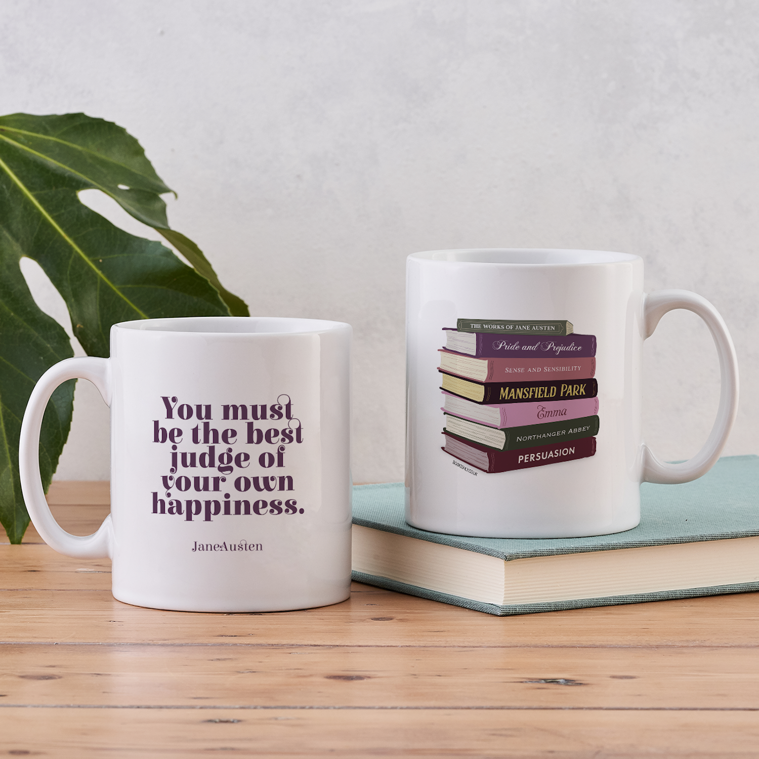 Jane Austen mug with book stack illustration on one side and the quote “You must be the best judge of your own happiness” on the other