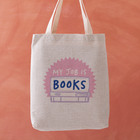 Tote bag with 'My Job is Books' design on a terracotta background