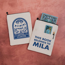 Personalised book sleeve featuring “Readers Make Leaders” design on one side and “This Book Belongs To Mila” text on the other.