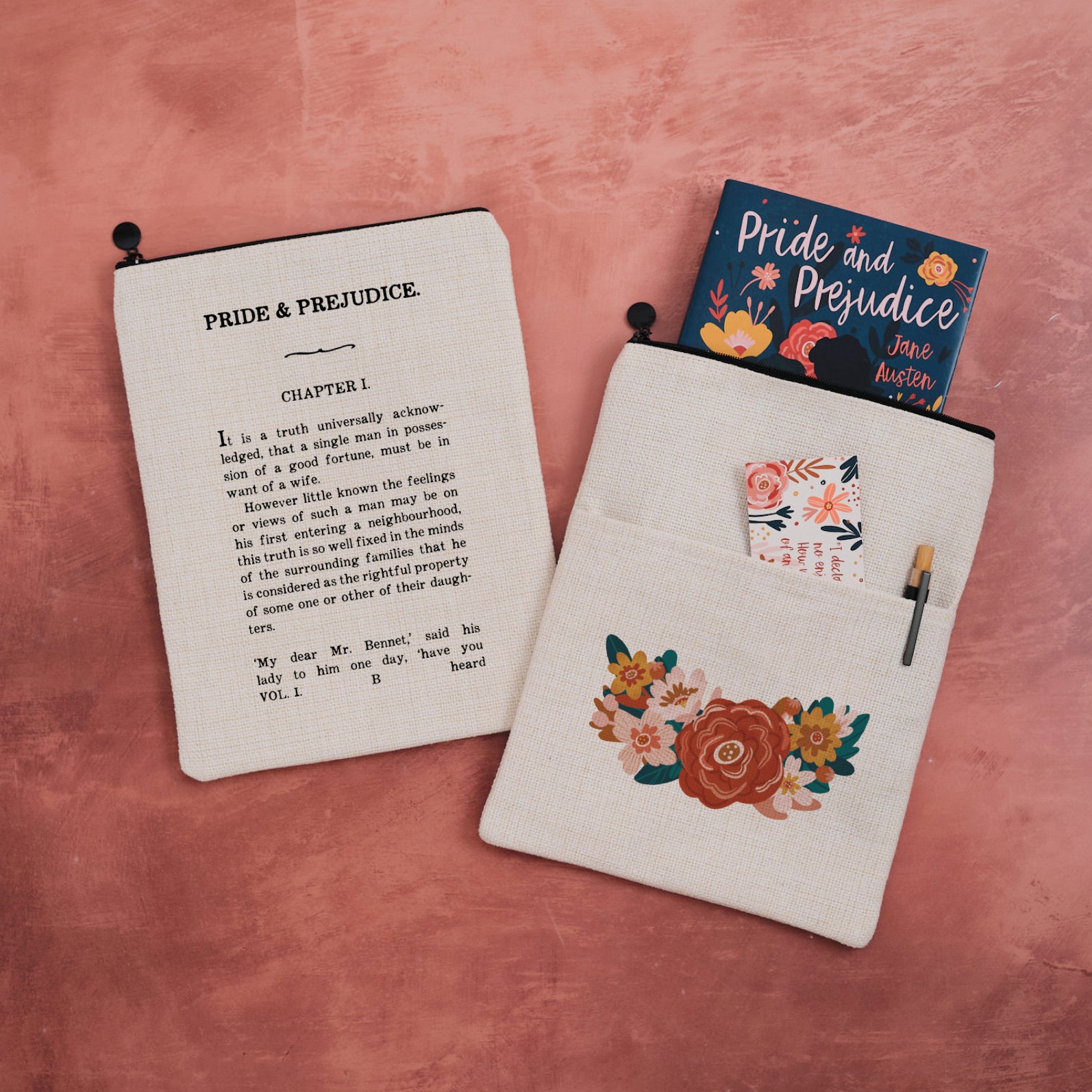 A zip topped book sleeve featuring a floral design on the front and Chapter One from Pride & Prejudice on the other.