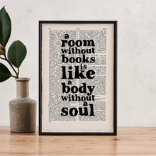 Framed vintage-style print with the quote “A room without books is like a body without a soul” printed on a dictionary page