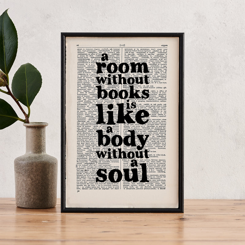 Framed vintage-style print with the quote “A room without books is like a body without a soul” printed on a dictionary page