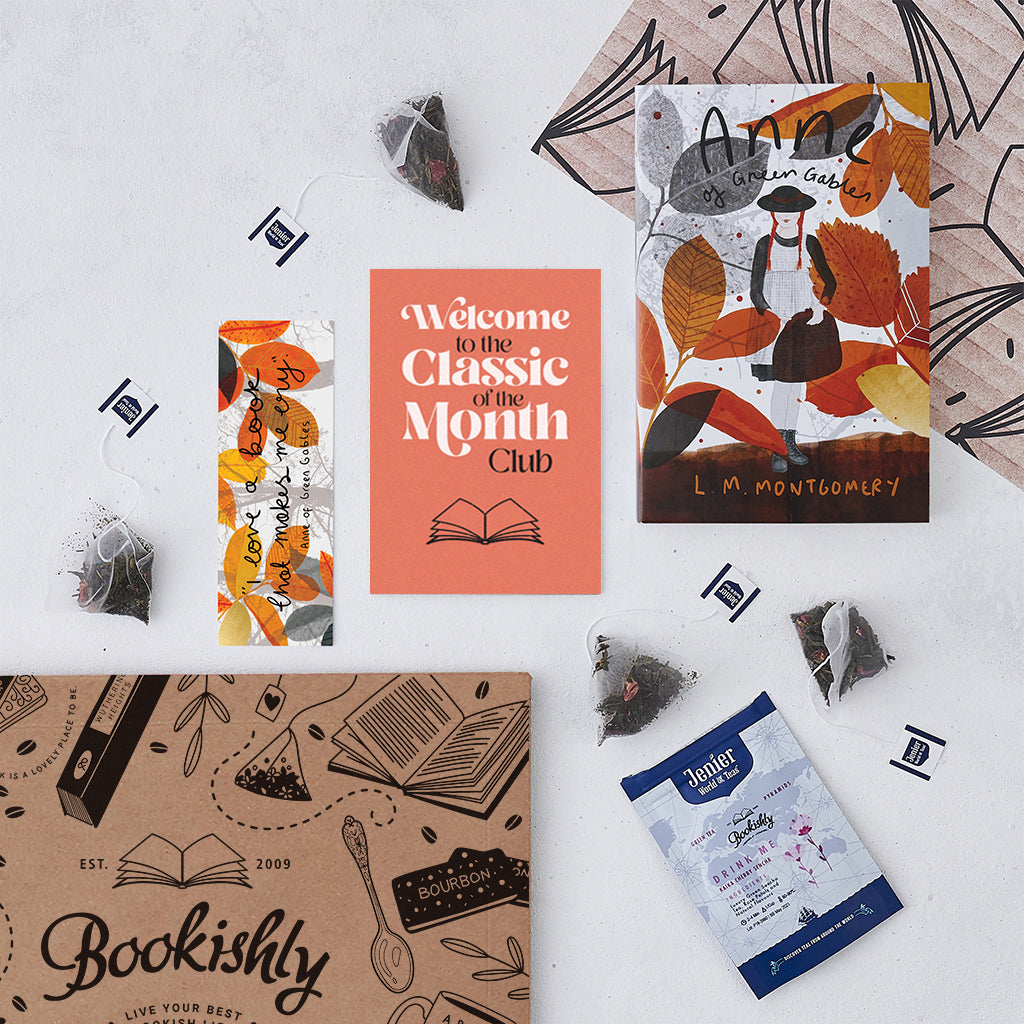 Flat lay of the Classic of the Month Club welcome pack – includes Anne of Green Gables with exclusive Bookishly cover, Jenier tea sachets, a bookmark, welcome card, and Bookishly gift box.