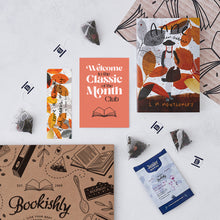 Flat lay of the Classic of the Month Club welcome pack – includes Anne of Green Gables with exclusive Bookishly cover, Jenier tea sachets, a bookmark, welcome card, and Bookishly gift box.