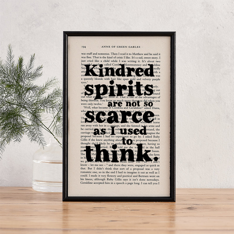 Framed book page print featuring the quote “Kindred spirits are not so scarce as I used to think” from Anne of Green Gables