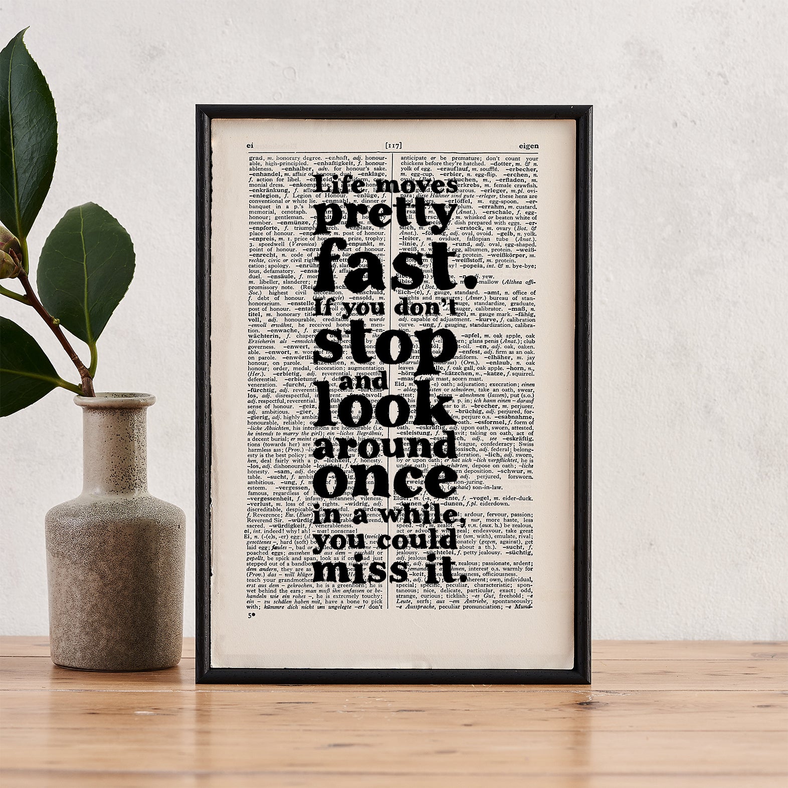 Framed quote print featuring the Ferris Bueller quote “Life moves pretty fast” on a vintage dictionary page