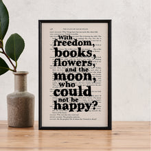 Framed book page print with the quote “With freedom, books, flowers, and the moon, who could not be happy?” printed in bold black type on a page from The Plays of Oscar Wilde.