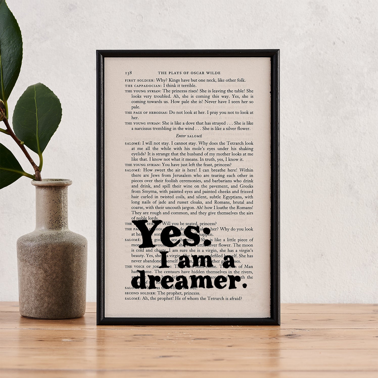 Framed book page art featuring the Oscar Wilde quote "Yes: I am a dreamer."