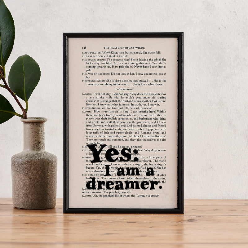Framed book page art featuring the Oscar Wilde quote "Yes: I am a dreamer."