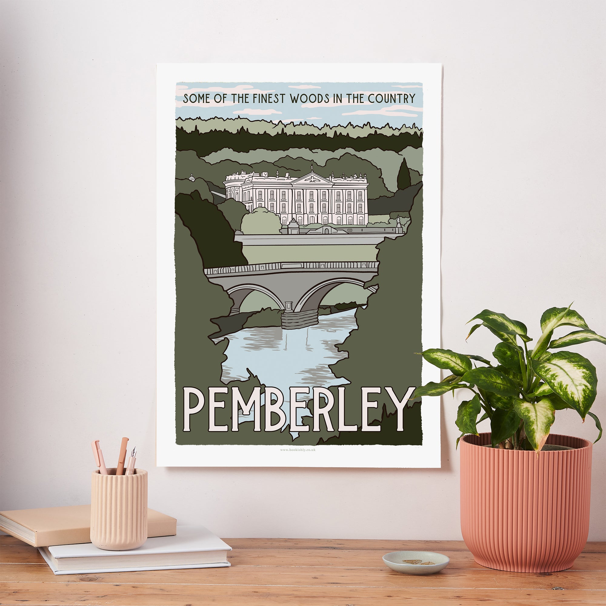 Pemberley fictional travel art print inspired by Pride and Prejudice, with a vintage-style illustration of a stately home, arched bridge and woodland landscape