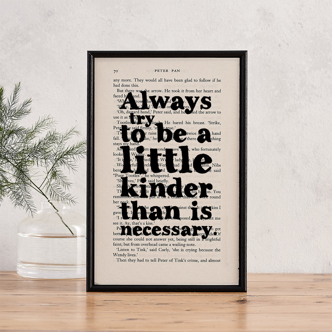 Framed book page print featuring the quote "Always try to be a little kinder than is necessary" from Peter Pan.