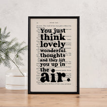 Framed book page print featuring the quote “You just think lovely wonderful thoughts and they lift you up in the air” from Peter Pan.