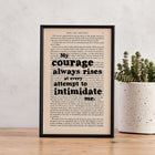 Framed book page print featuring the quote "My courage always rises at every attempt to intimidate me" from Pride and Prejudice.
