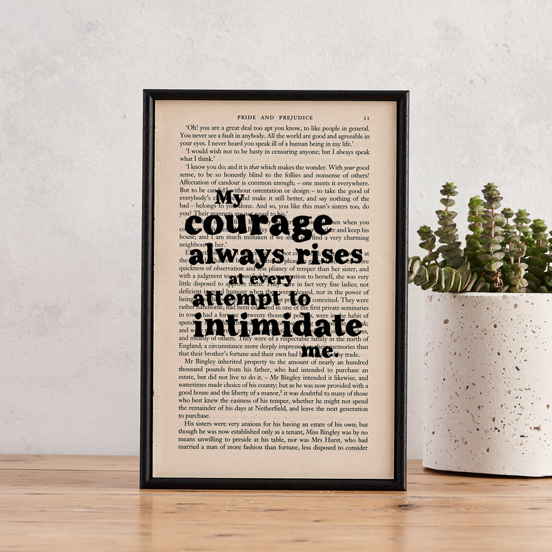 Framed book page print featuring the quote "My courage always rises at every attempt to intimidate me" from Pride and Prejudice.