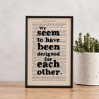 Framed book page print featuring the quote “We seem to have been designed for each other” from Pride and Prejudice.

